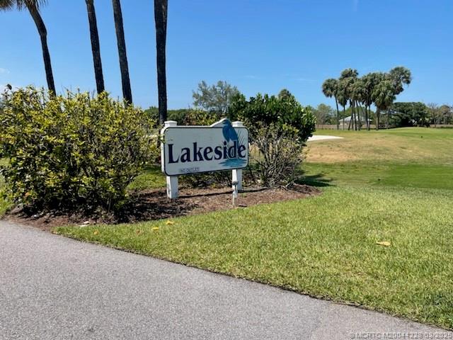 5565 Northeast Gulfstream Way Stuart, FL 34996 - Photo 21 of 21 a sign that is sitting in the grass next to a road