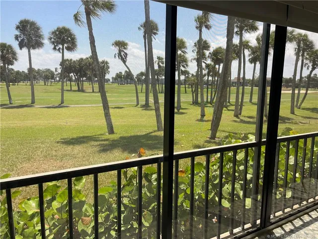 a view of swimming pool from a balcony
