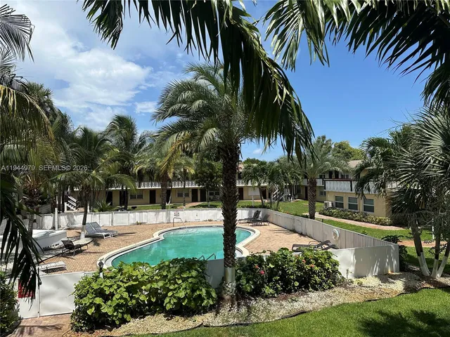 a view of a swimming pool with a garden