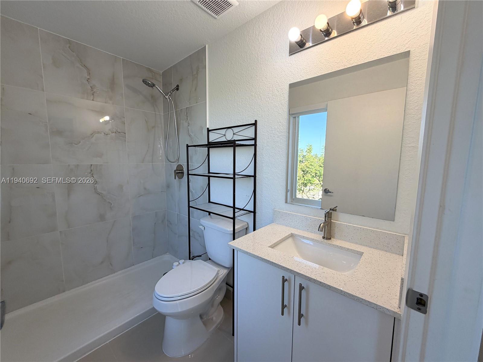 25823 Southwest 145th Avenue Miami, FL 33170 - Photo 14 of 18 a bathroom with a sink a toilet and shower
