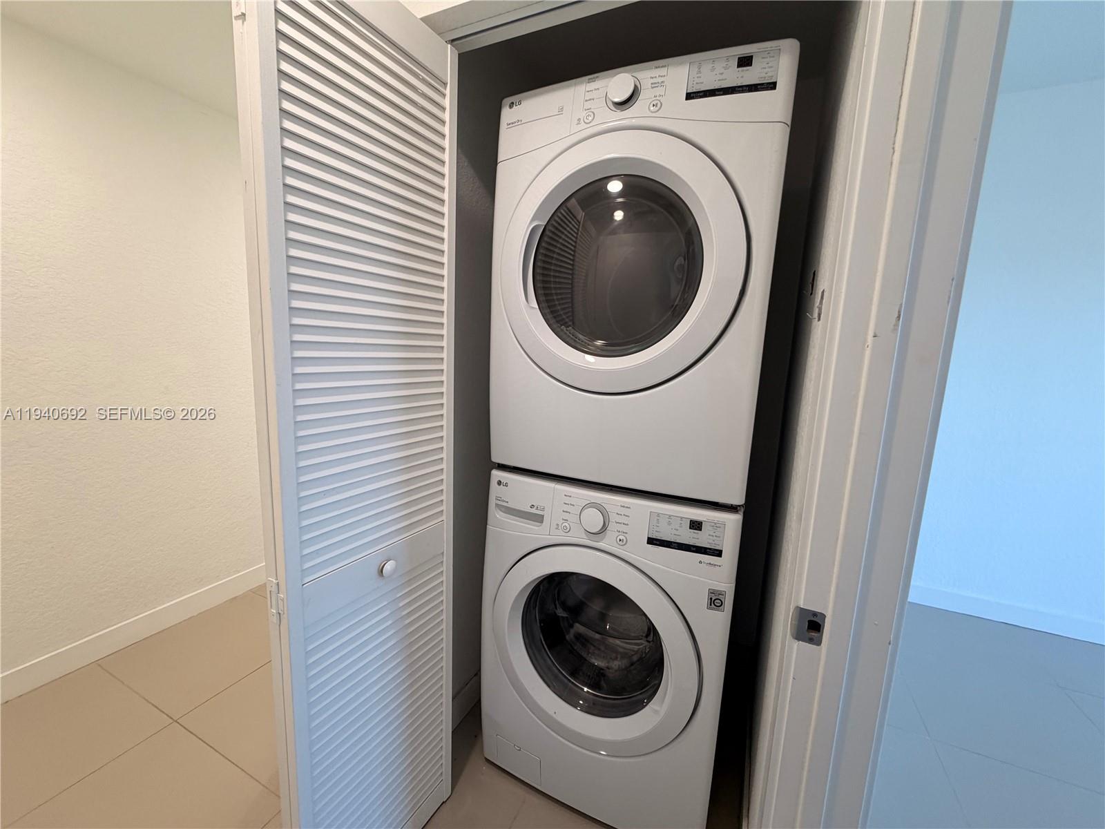 25823 Southwest 145th Avenue Miami, FL 33170 - Photo 16 of 18 a utility room with dryer and washer