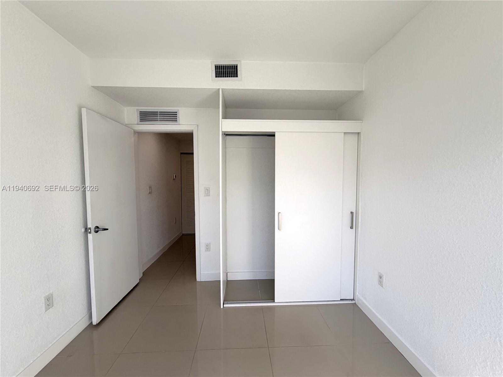 25823 Southwest 145th Avenue Miami, FL 33170 - Photo 10 of 18 an empty room with a space