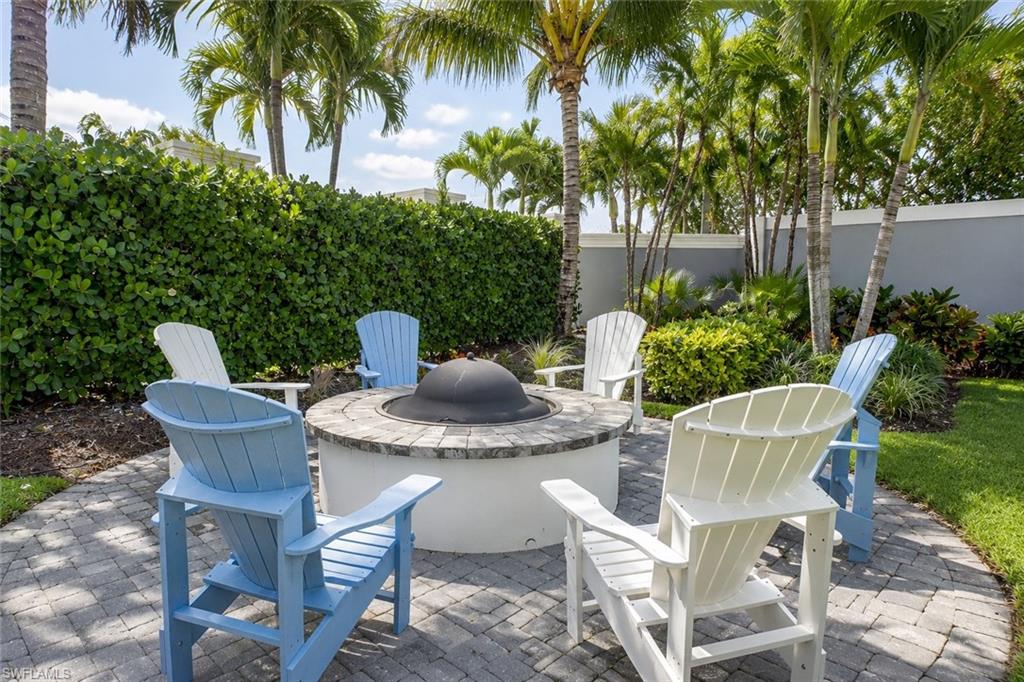 2620 Seychelles Circle, Unit 1302 Naples, FL 34112 - Photo 39 of 43 a view of a table and chair in the patio