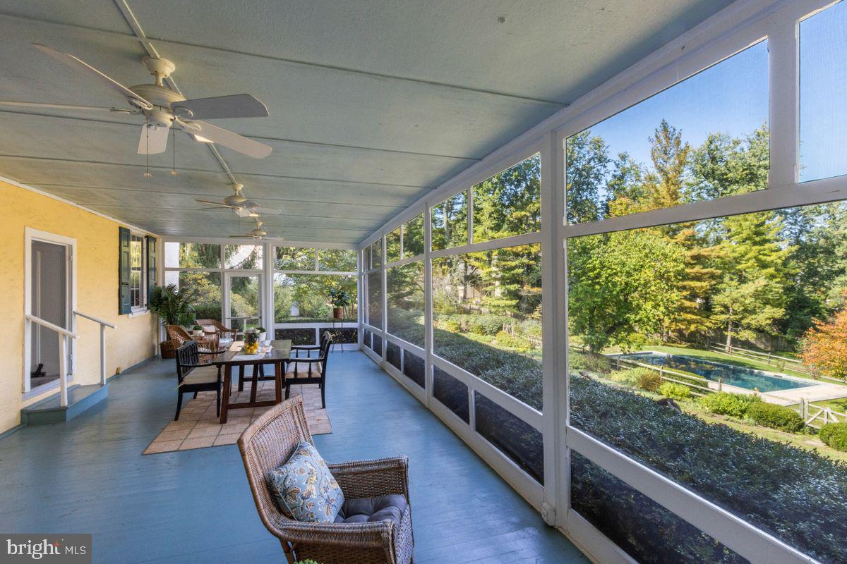 569 Conestoga Road Villanova, PA 19085 - Photo 40 of 52 Screened In Porch Overlooks Pool & Rear Yard