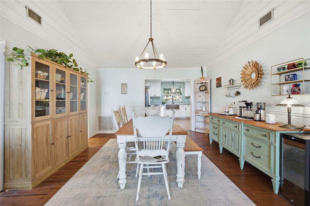 10550 Northeast 222nd Place Road Fort McCoy, FL 32134 - Photo 11 of 48 a dining room with furniture a chandelier and window