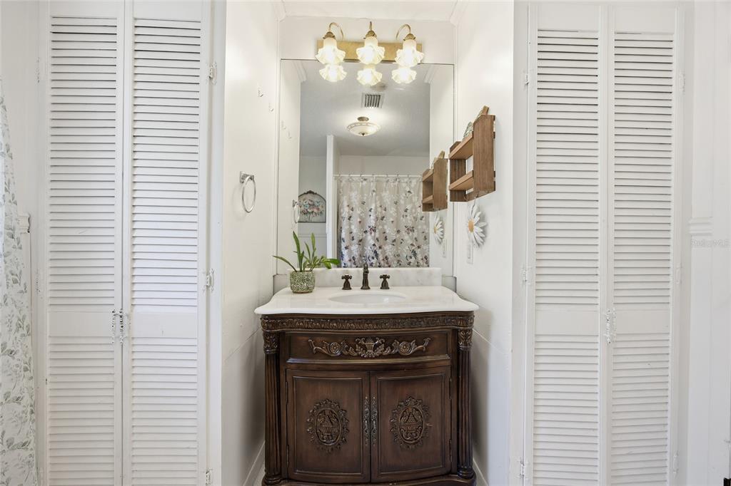 10550 Northeast 222nd Place Road Fort McCoy, FL 32134 - Photo 25 of 48 a bathroom with a sink and a mirror