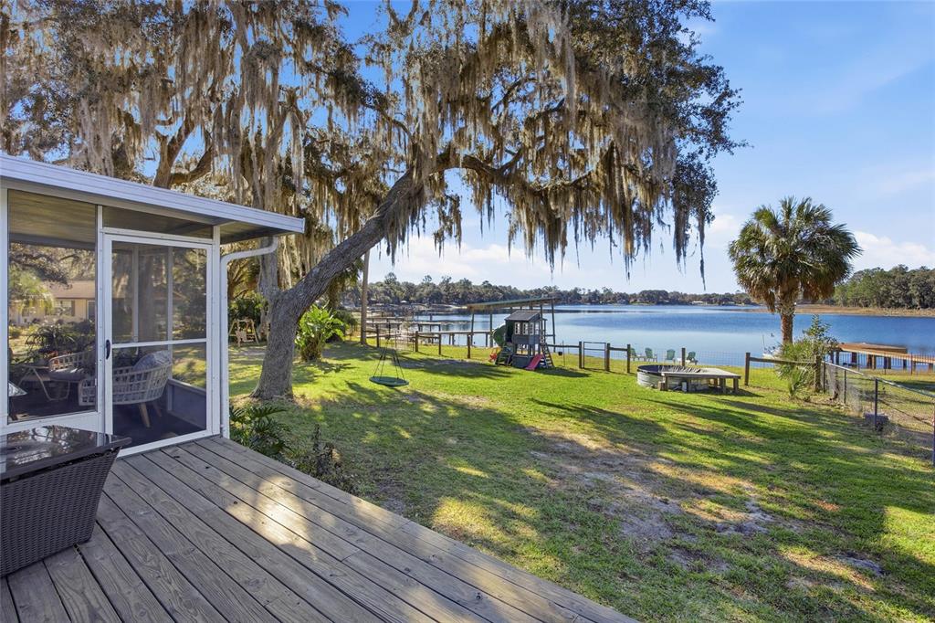 10550 Northeast 222nd Place Road Fort McCoy, FL 32134 - Photo 33 of 48 a view of a house with a yard