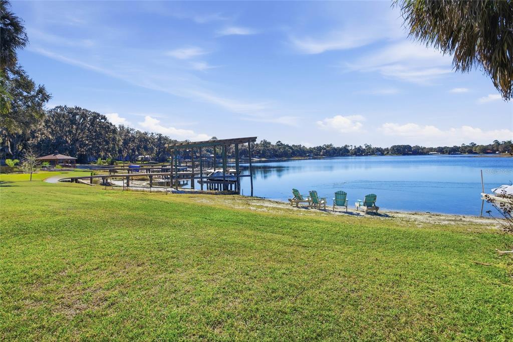 10550 Northeast 222nd Place Road Fort McCoy, FL 32134 - Photo 35 of 48 a view of a lake with houses in the back