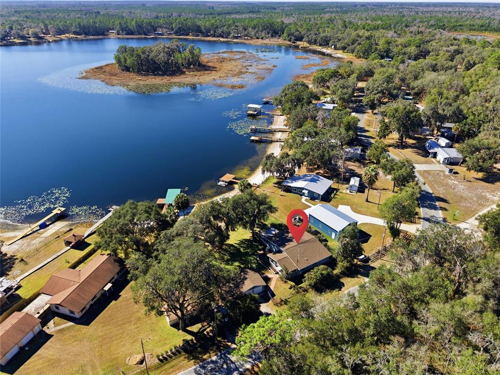 10550 Northeast 222nd Place Road Fort McCoy, FL 32134 - Photo 39 of 48 an aerial view of residential house with outdoor space and lake view