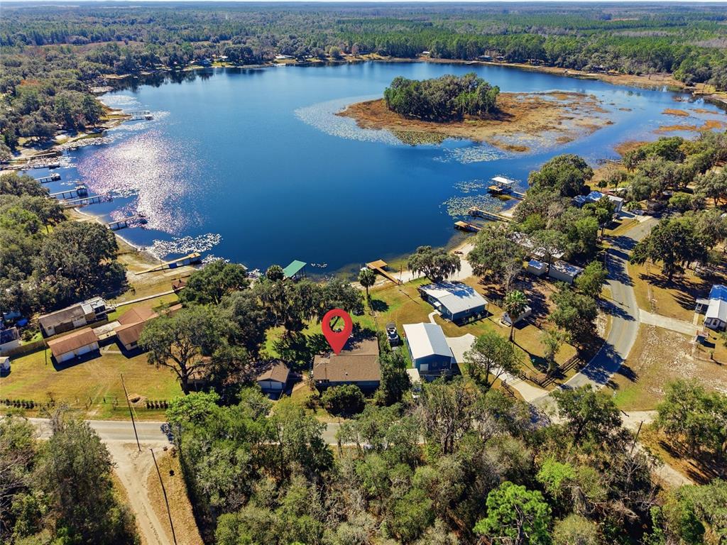 10550 Northeast 222nd Place Road Fort McCoy, FL 32134 - Photo 46 of 48 an aerial view of a house with a lake view