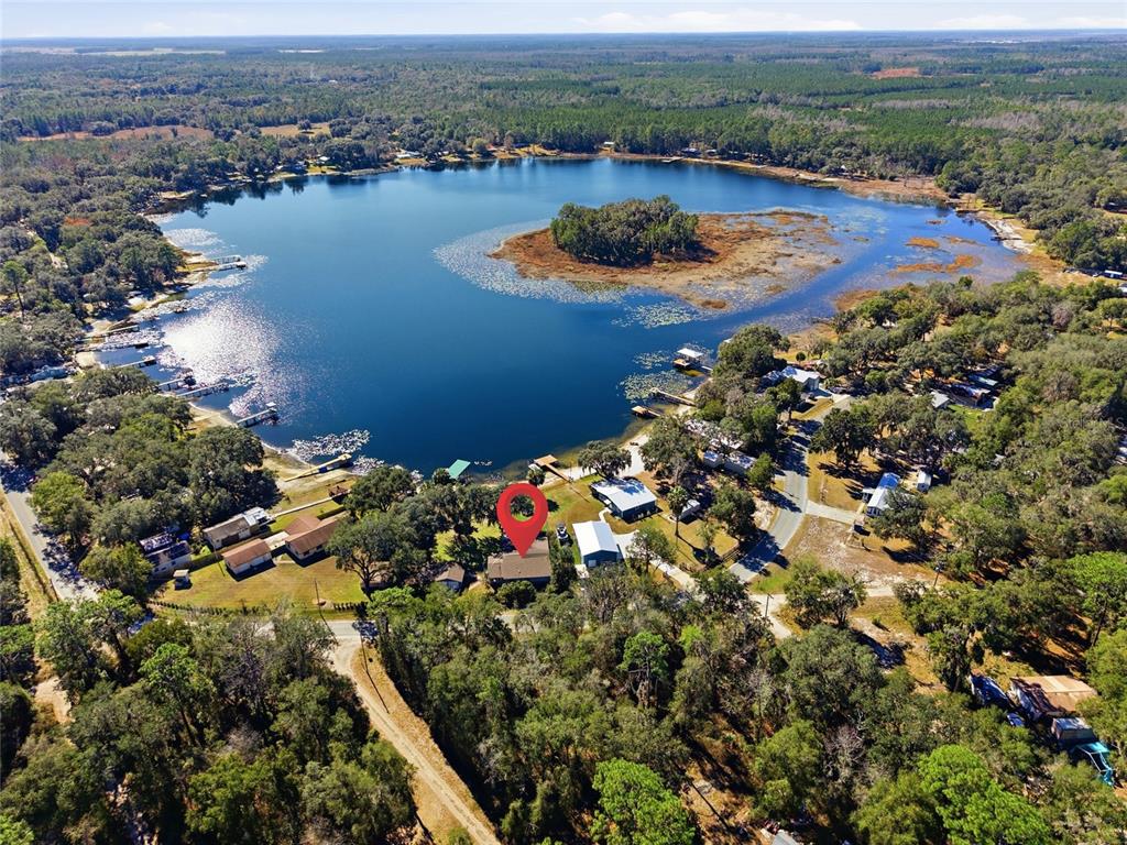 10550 Northeast 222nd Place Road Fort McCoy, FL 32134 - Photo 47 of 48 an aerial view of lake residential house with swimming pool and ocean view