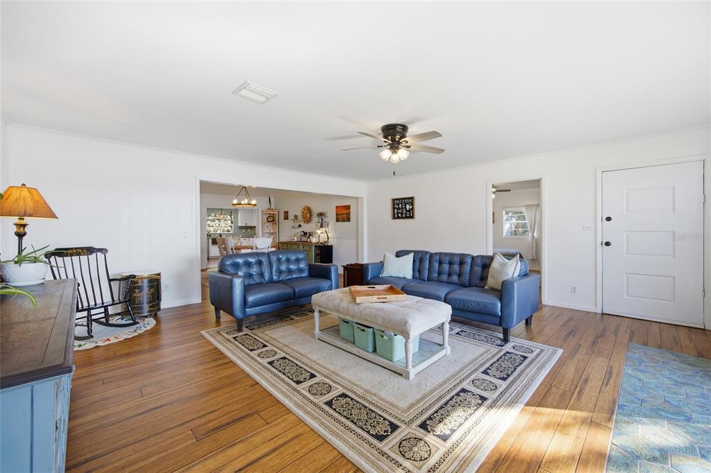 10550 Northeast 222nd Place Road Fort McCoy, FL 32134 - Photo 5 of 48 a living room with furniture and wooden floor
