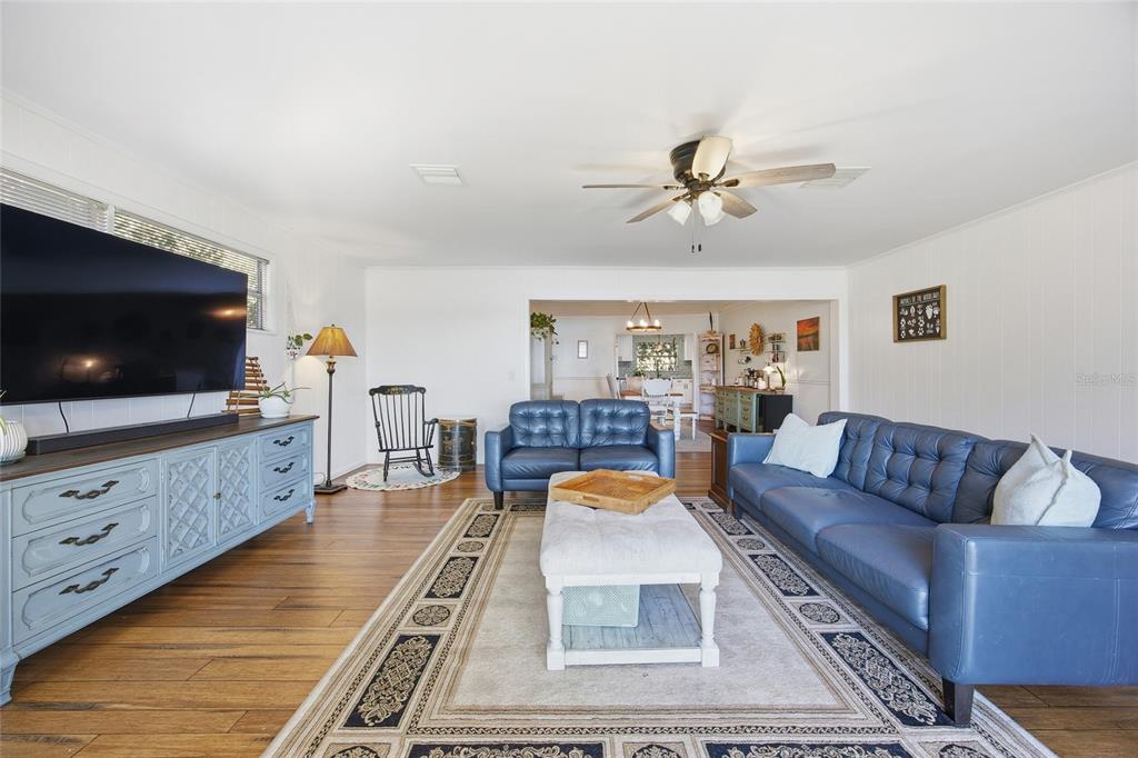 10550 Northeast 222nd Place Road Fort McCoy, FL 32134 - Photo 6 of 48 a living room with furniture and a flat screen tv
