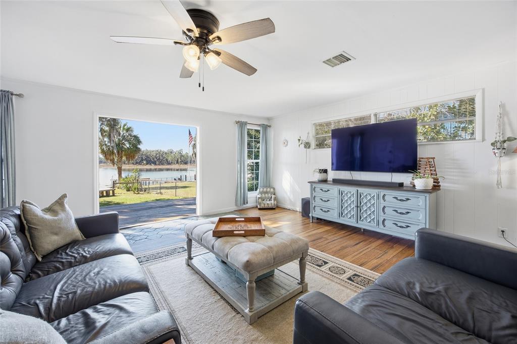 10550 Northeast 222nd Place Road Fort McCoy, FL 32134 - Photo 8 of 48 a living room with furniture and a flat screen tv