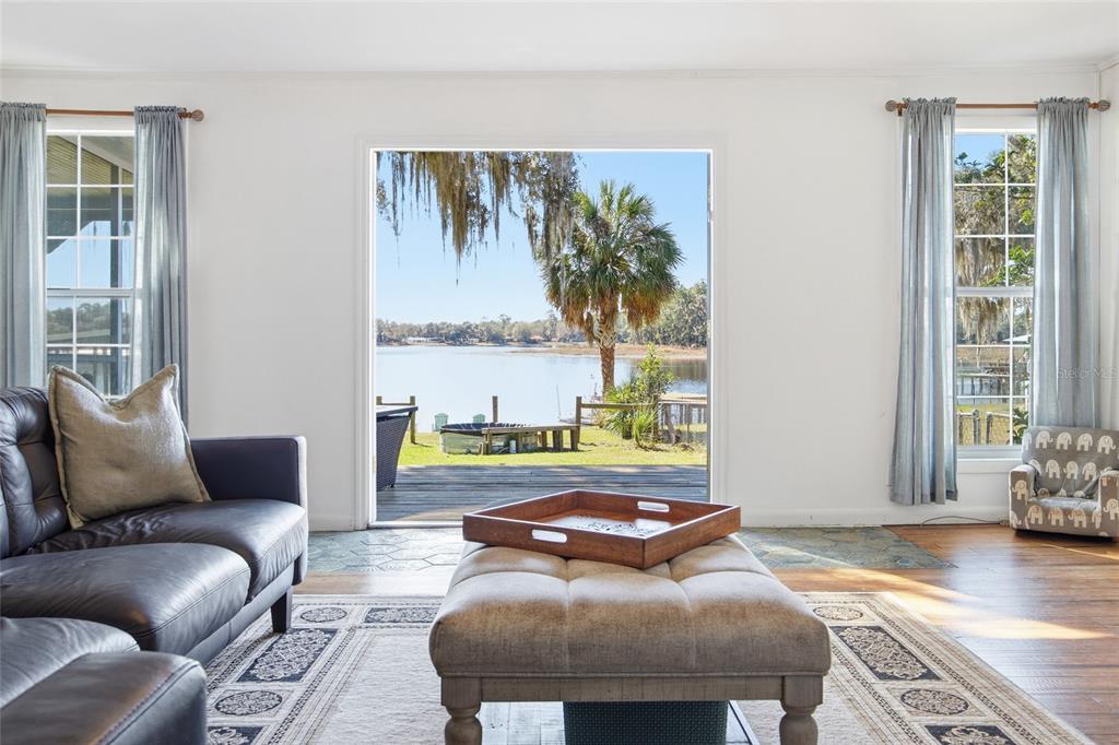 10550 Northeast 222nd Place Road Fort McCoy, FL 32134 - Photo 10 of 48 a living room with furniture and a large window