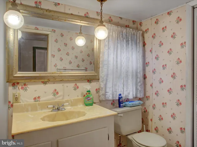 a bathroom with a sink and mirror