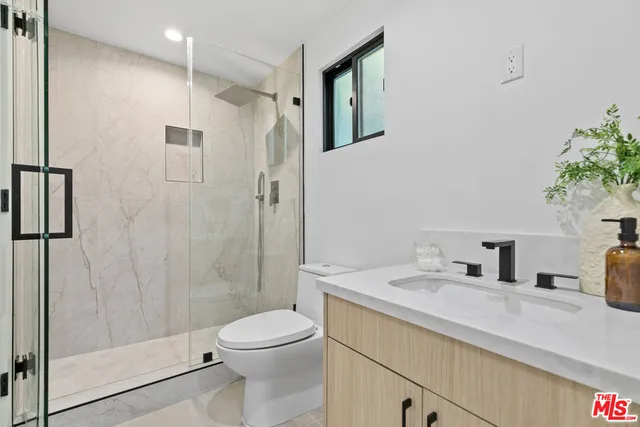 a view of balcony with furniture and city view