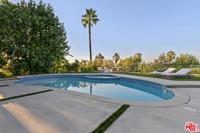 a view of a chairs and table in the patio