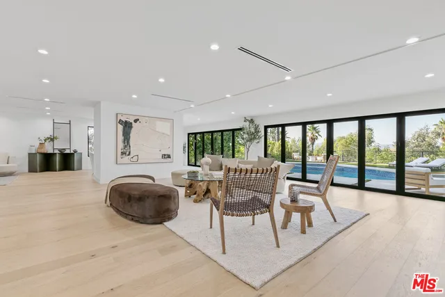 a view of a bathroom with bathtub and shower