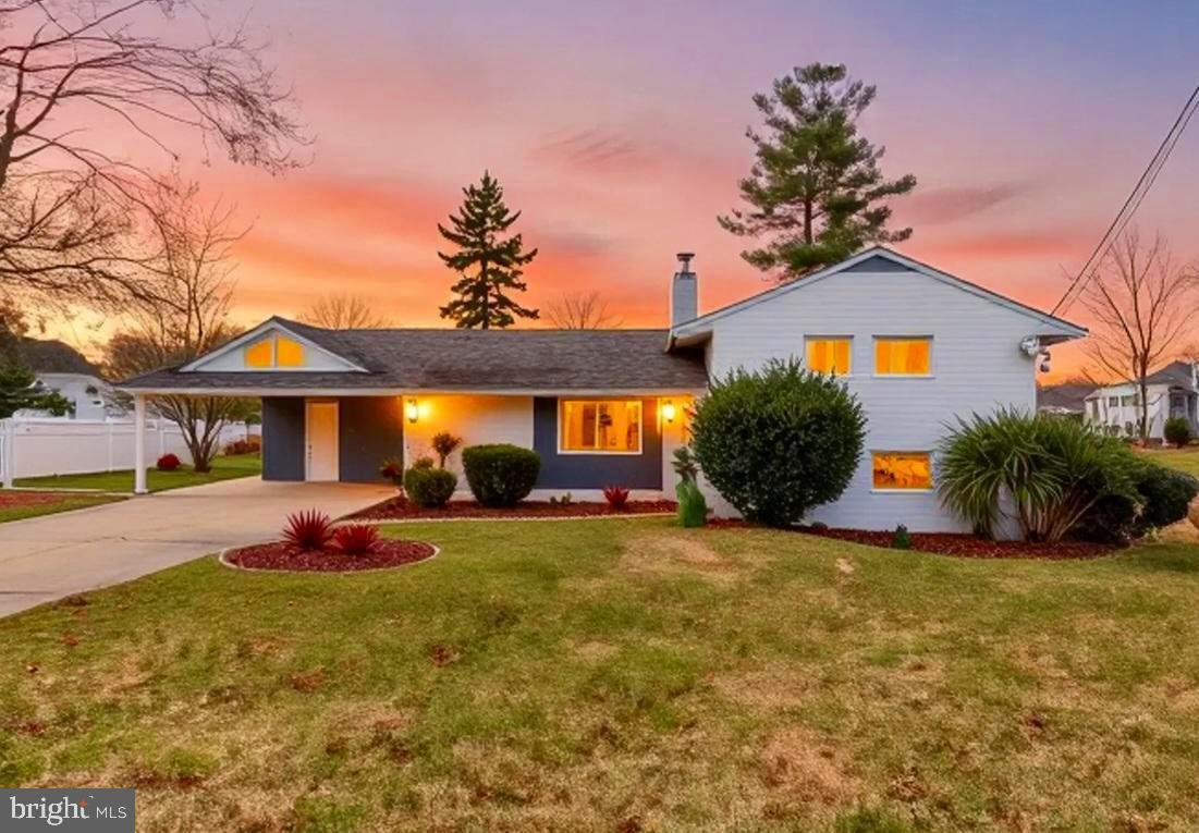 a view of a house with swimming pool and sitting area