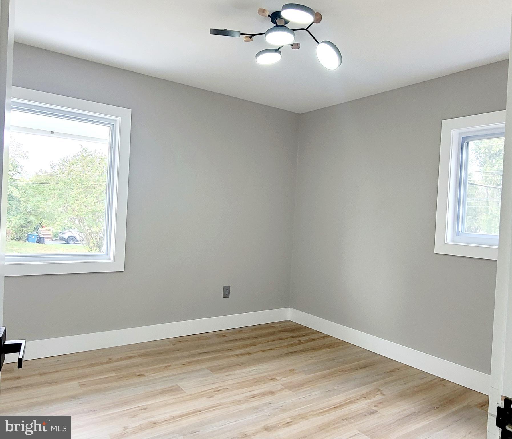 5401 Ferndale Street Springfield, VA 22151 - Photo 15 of 28 a view of empty room with wooden floor and fan