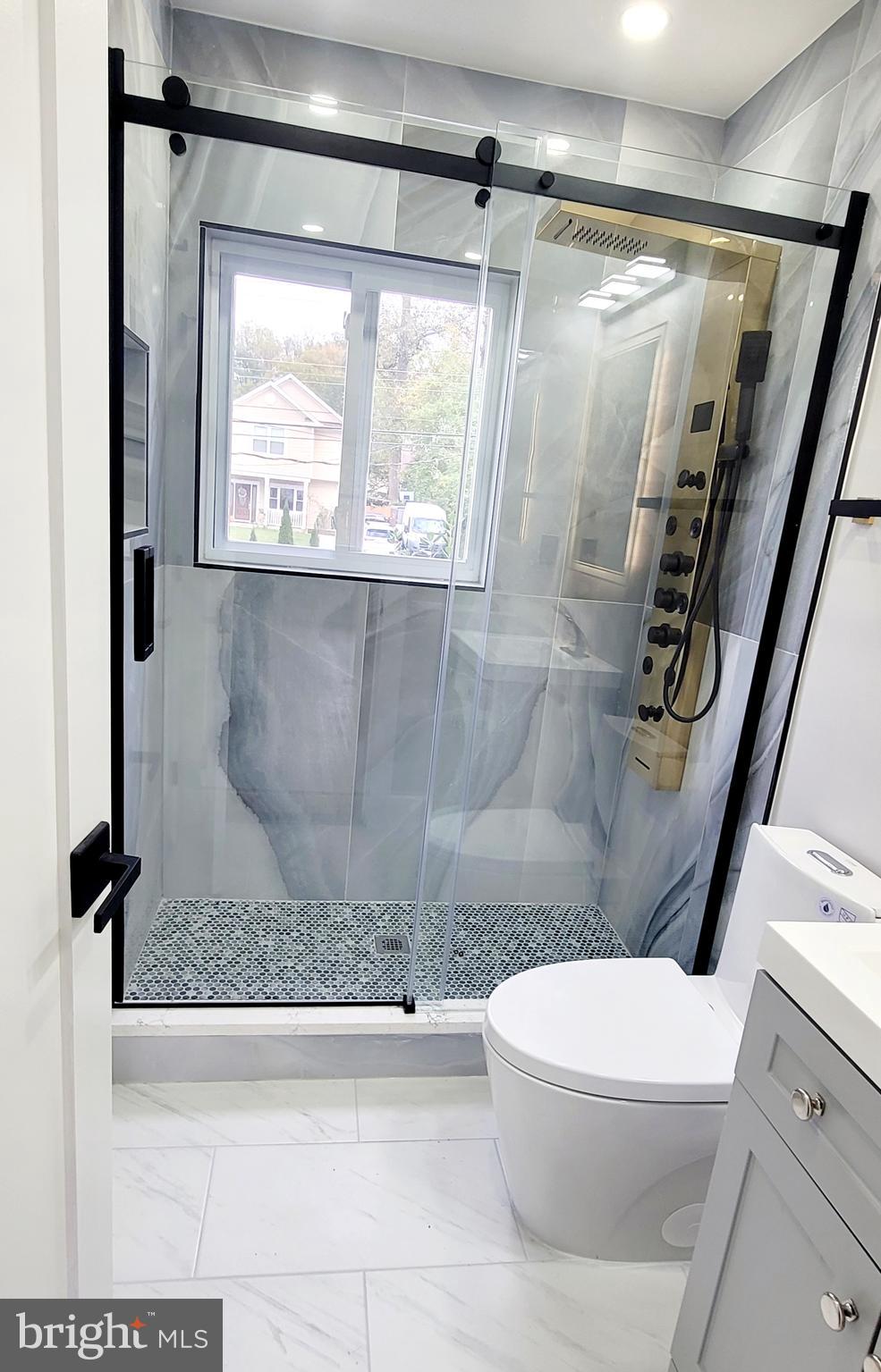 5401 Ferndale Street Springfield, VA 22151 - Photo 17 of 28 a white toilet sitting next to a bath tub shower