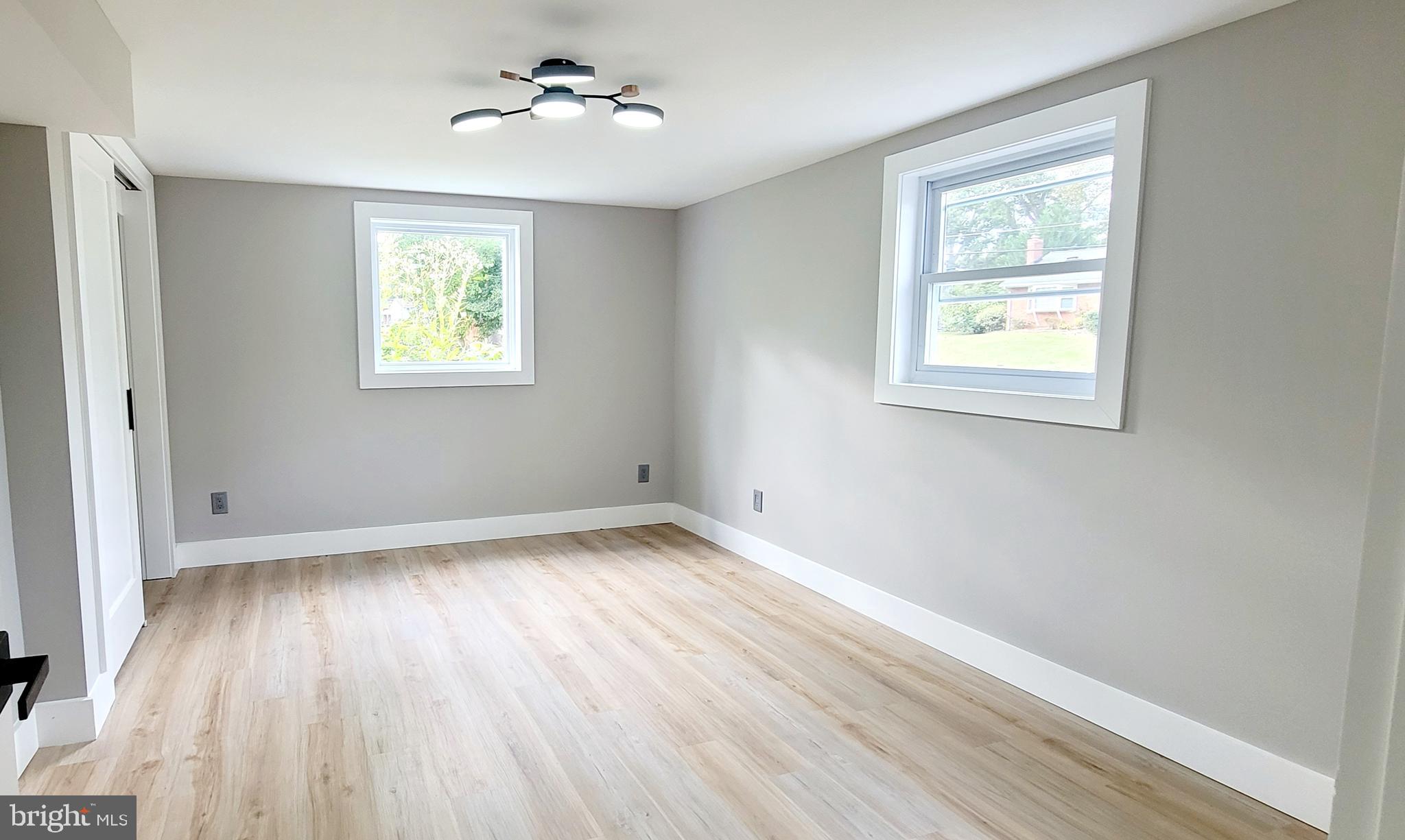 5401 Ferndale Street Springfield, VA 22151 - Photo 26 of 28 a view of empty room with wooden floor and fan