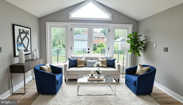 a living room with furniture potted plant and a window