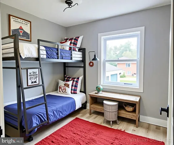 a bedroom with furniture and a window