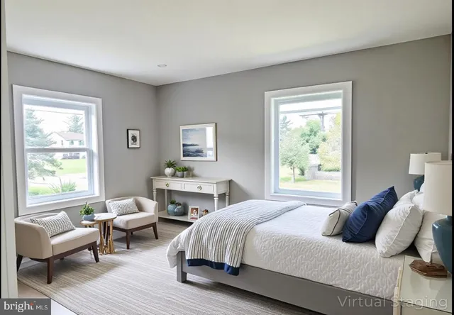 a bedroom with a bed wooden floor and windows