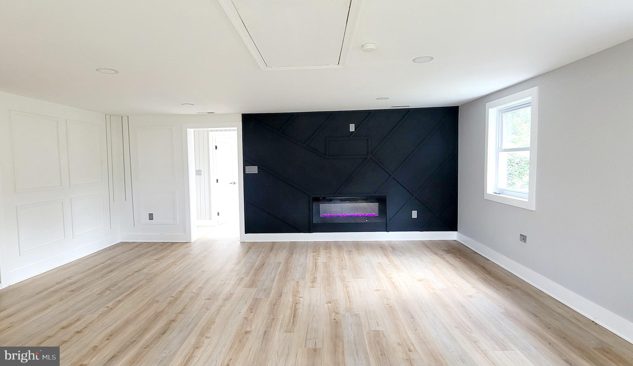 5401 Ferndale Street Springfield, VA 22151 - Photo 9 of 28 a view of an empty room with wooden floor and a window