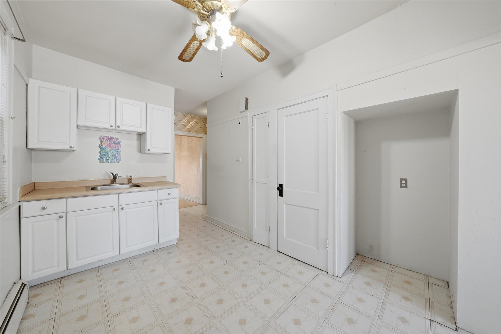 3822 West 64th Street Chicago, IL 60629 - Photo 11 of 33 a kitchen with cabinets and window