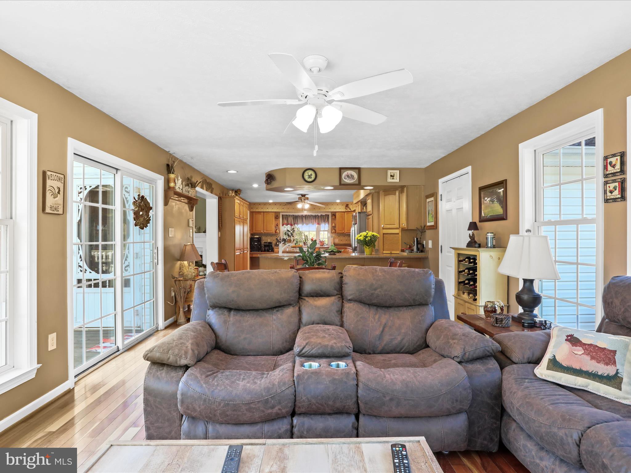 438 Thistle Ridge Lane Ranson, WV 25438 - Photo 29 of 83 a living room with furniture and a chandelier