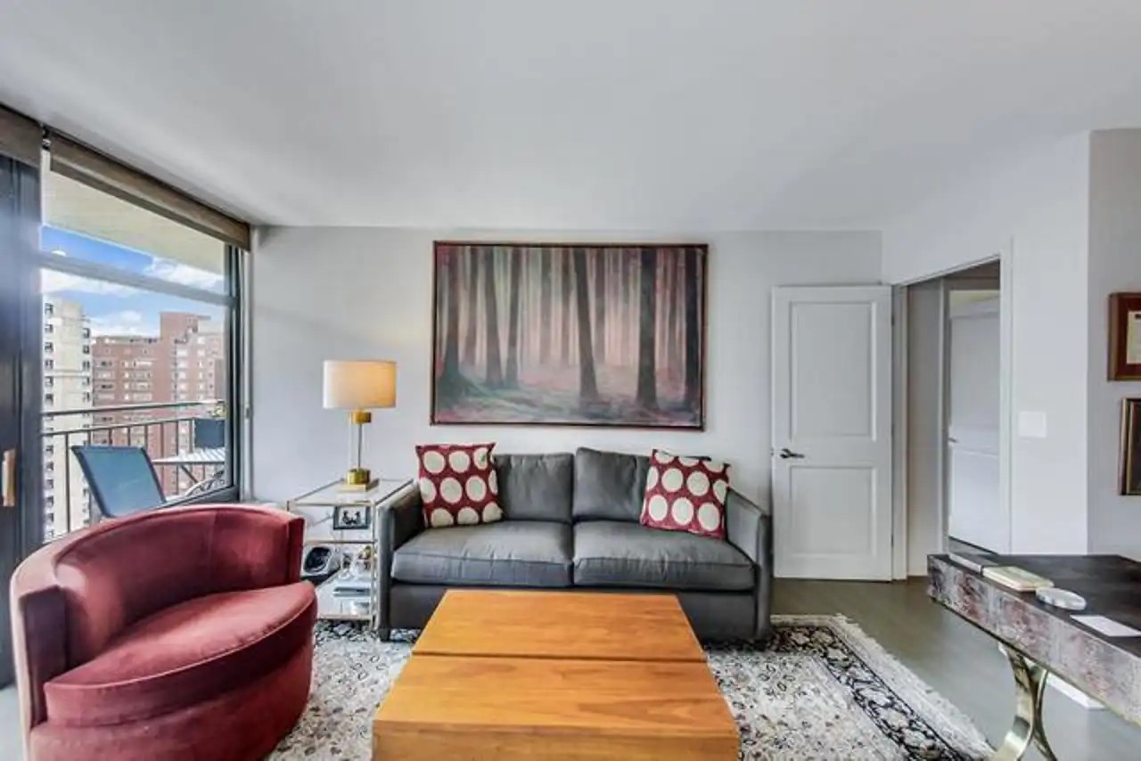 1430 North Astor Street, Unit 19C Chicago, IL 60610 - Photo 12 of 41 a living room with furniture rug and window