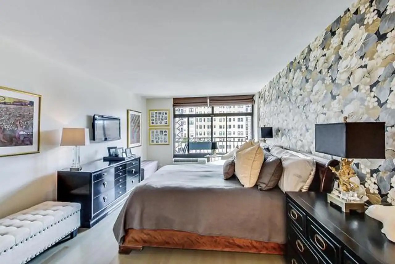 1430 North Astor Street, Unit 19C Chicago, IL 60610 - Photo 15 of 41 a bedroom with a bed and wooden floor