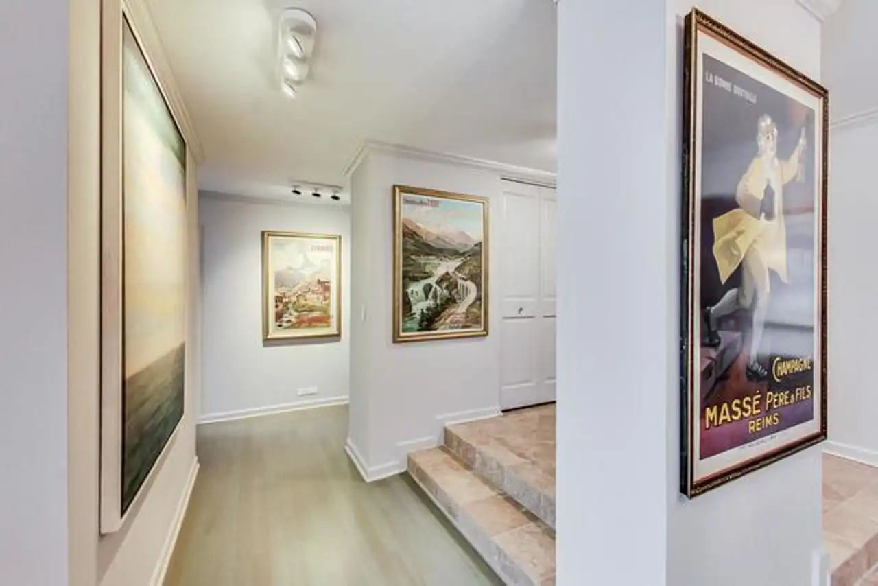 1430 North Astor Street, Unit 19C Chicago, IL 60610 - Photo 2 of 41 a view of a hallway to a bedroom with wooden floor and window