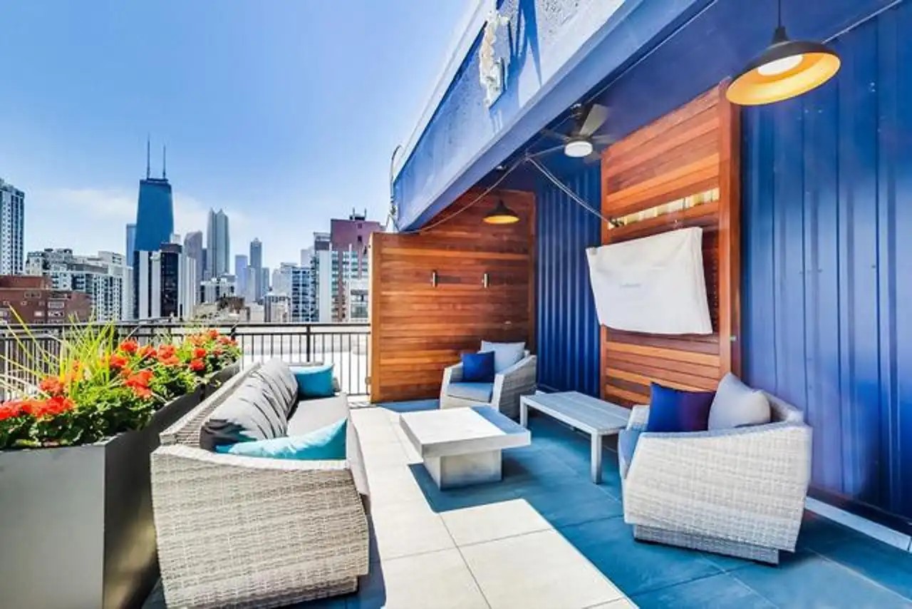 1430 North Astor Street, Unit 19C Chicago, IL 60610 - Photo 33 of 41 a balcony with furniture and a potted plant