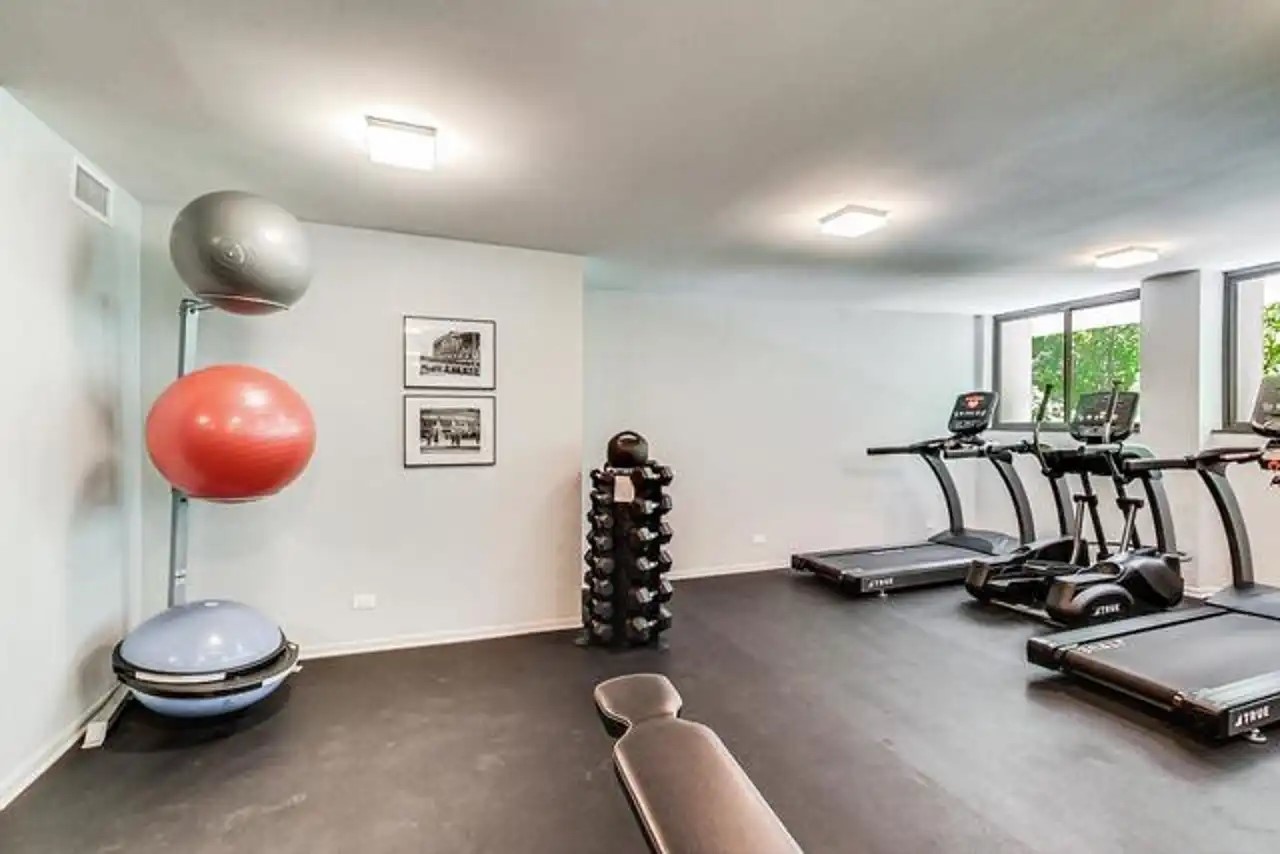 1430 North Astor Street, Unit 19C Chicago, IL 60610 - Photo 36 of 41 a room with gym equipment