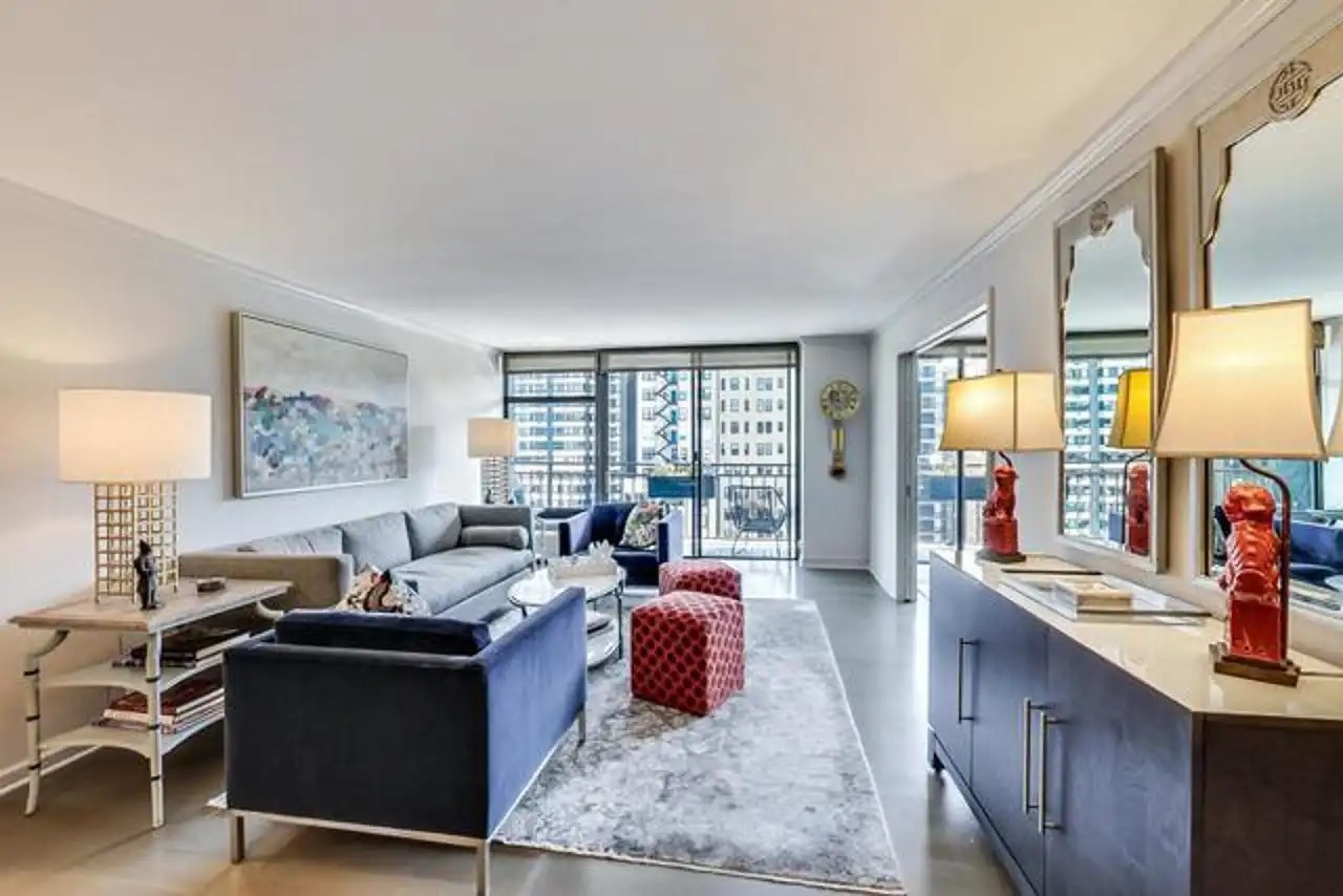 1430 North Astor Street, Unit 19C Chicago, IL 60610 - Photo 4 of 41 a living room with furniture large window and a table