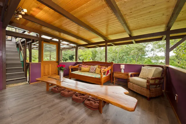 a bedroom with a bed and a wooden floor