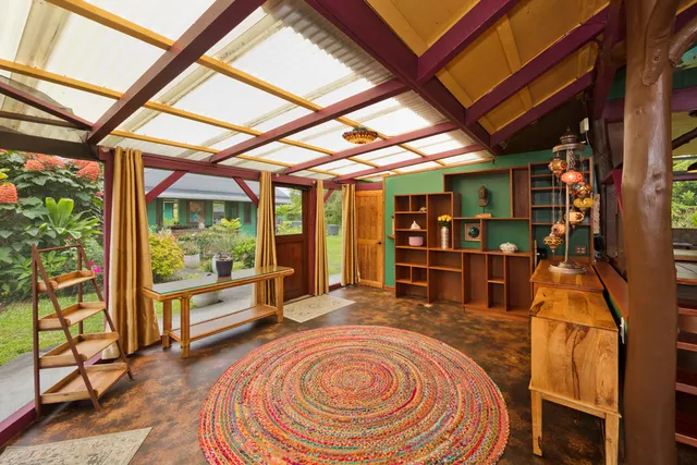 a room with lots of furniture and a large window