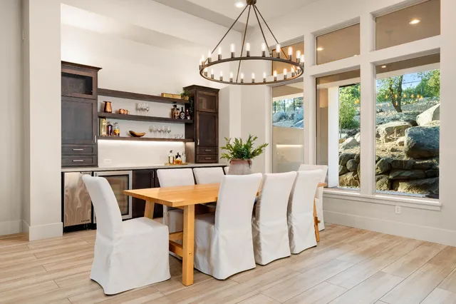 a spacious bedroom with a bed and a flat screen tv