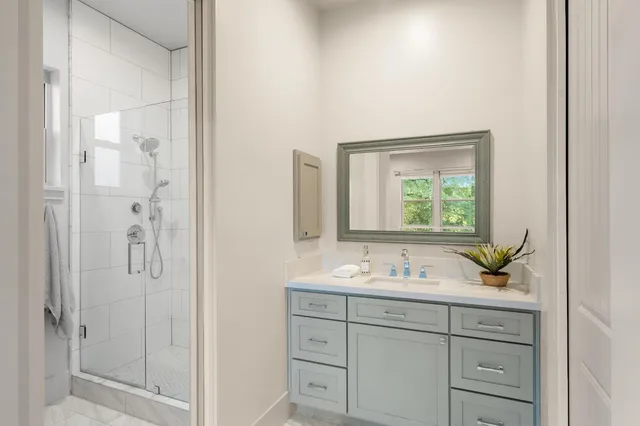 a kitchen with stainless steel appliances granite countertop a refrigerator a stove a sink and a microwave