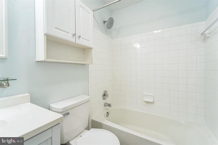 11 Gemstone Court Baltimore, MD 21244 - Photo 14 of 19 a white toilet sitting next to a bath tub