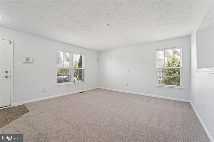 11 Gemstone Court Baltimore, MD 21244 - Photo 3 of 19 an empty room with windows