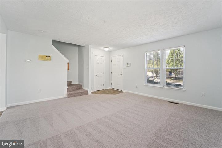 11 Gemstone Court Baltimore, MD 21244 - Photo 5 of 19 a view of an empty room with a window