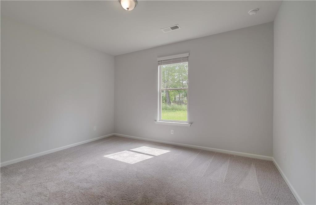 116 Haverling Pass Hampton, GA 30228 - Photo 19 of 38 an empty room with a window