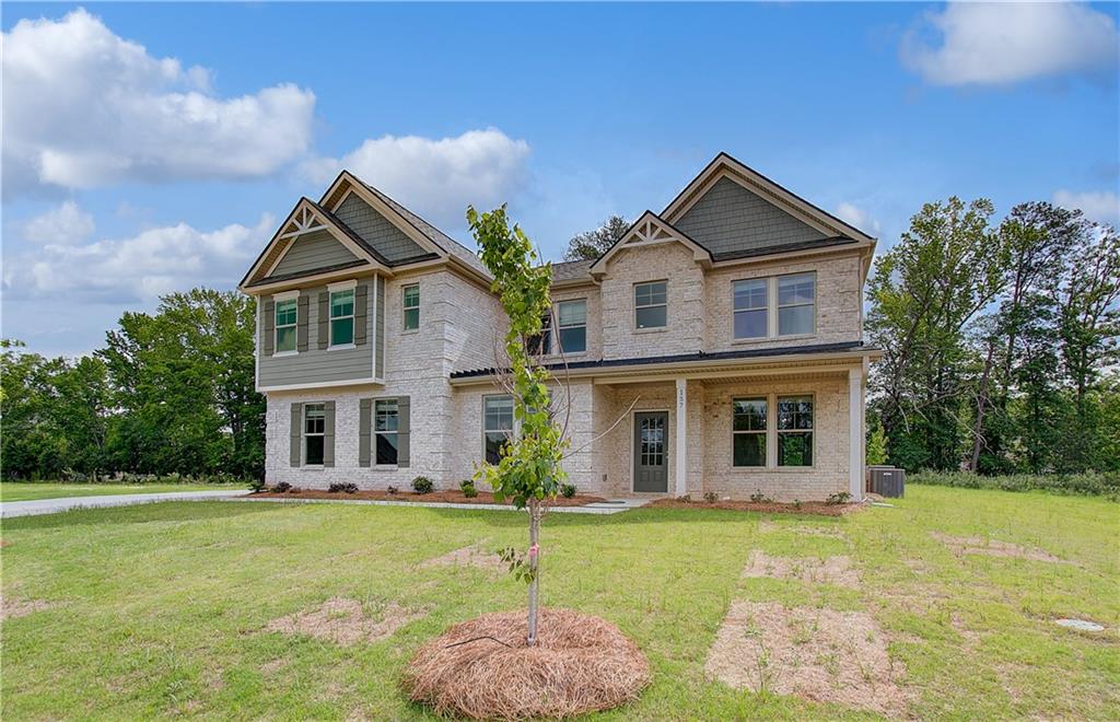 116 Haverling Pass Hampton, GA 30228 - Photo 2 of 38 a front view of a house with garden