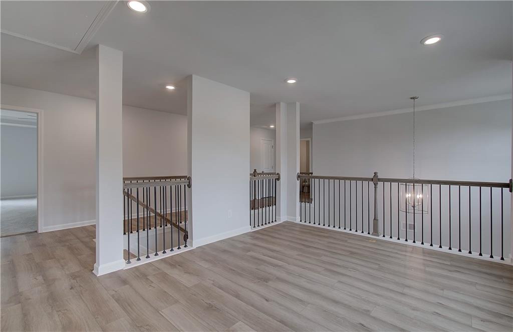 116 Haverling Pass Hampton, GA 30228 - Photo 21 of 38 a view of a hallway with wooden floor