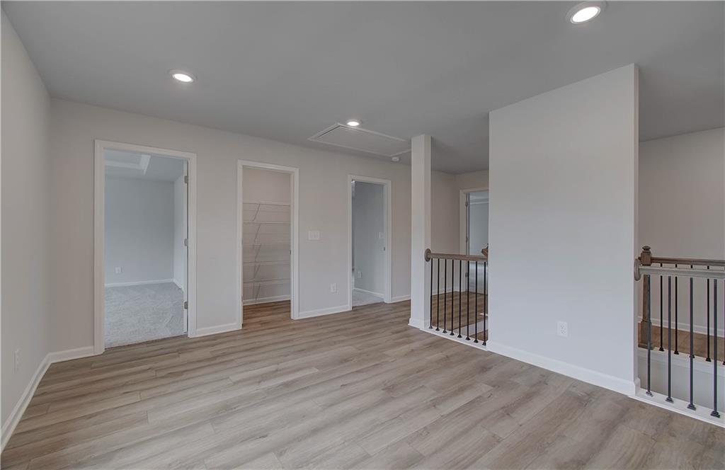 116 Haverling Pass Hampton, GA 30228 - Photo 22 of 38 a view of empty room with wooden floor